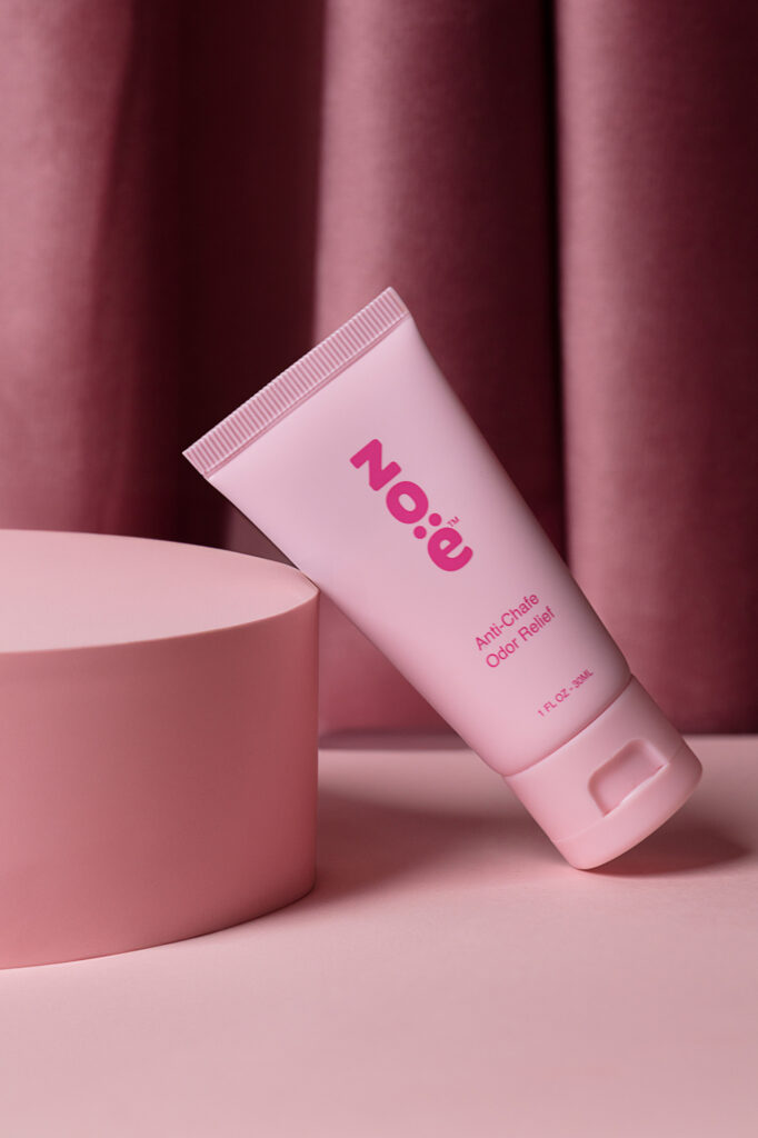 Zoe photoshoot Pink product on a pink table with dark background, photographed by Atlanta product photographer Natalia Tamariz, highlighting vibrant product design for small brands.